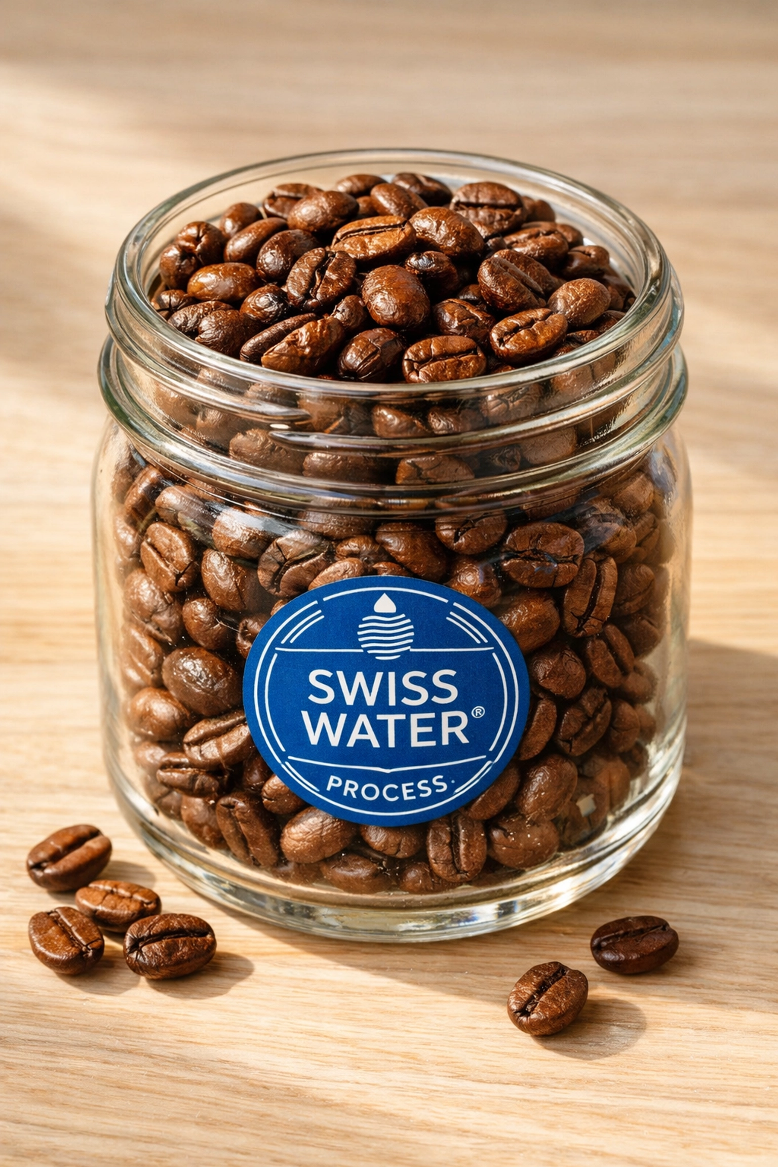 Premium Swiss Water Process decaf coffee beans in glass jar