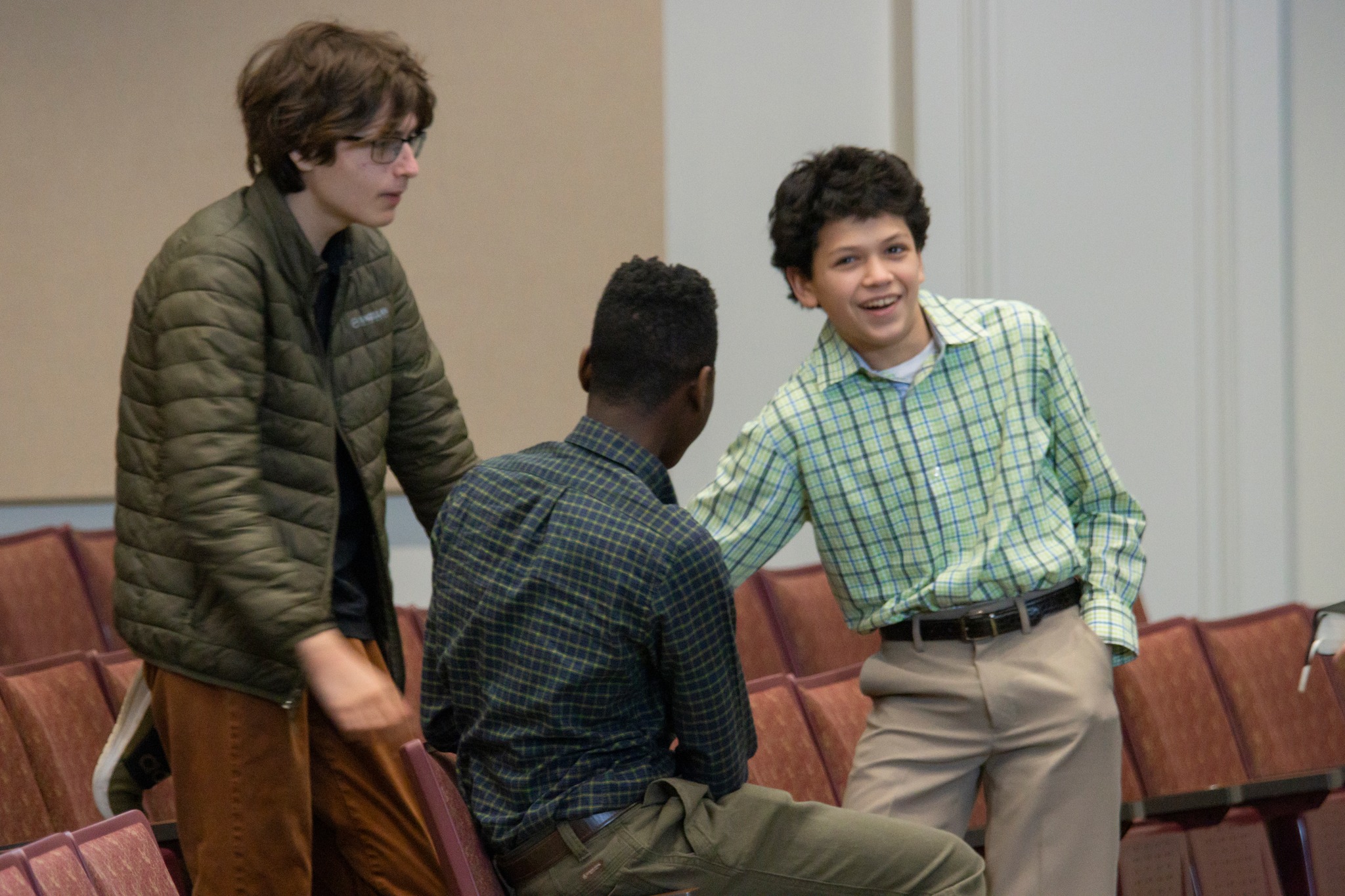 Three Boys in Church Auditorium
