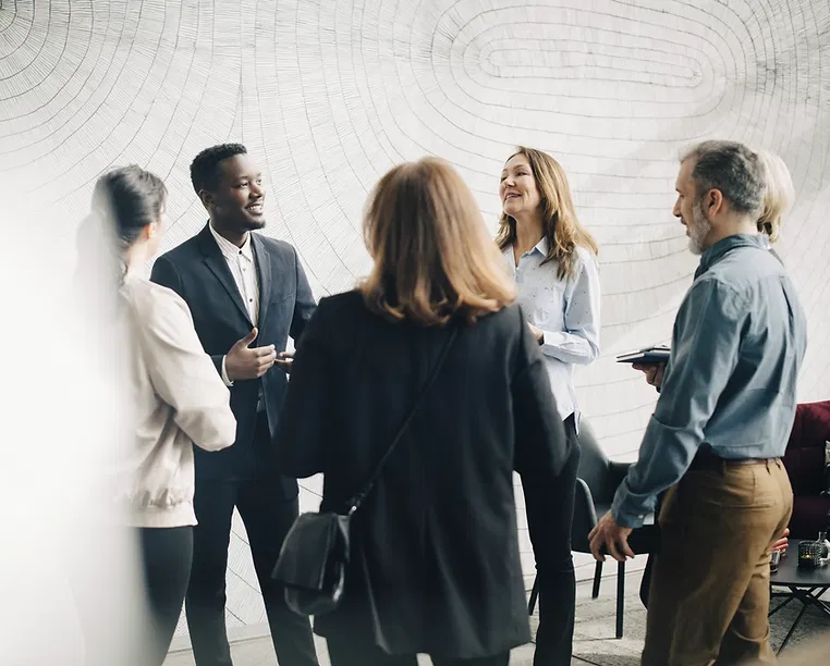 A diverse group of professionals engaged in collaborative problem-solving and strategic planning.