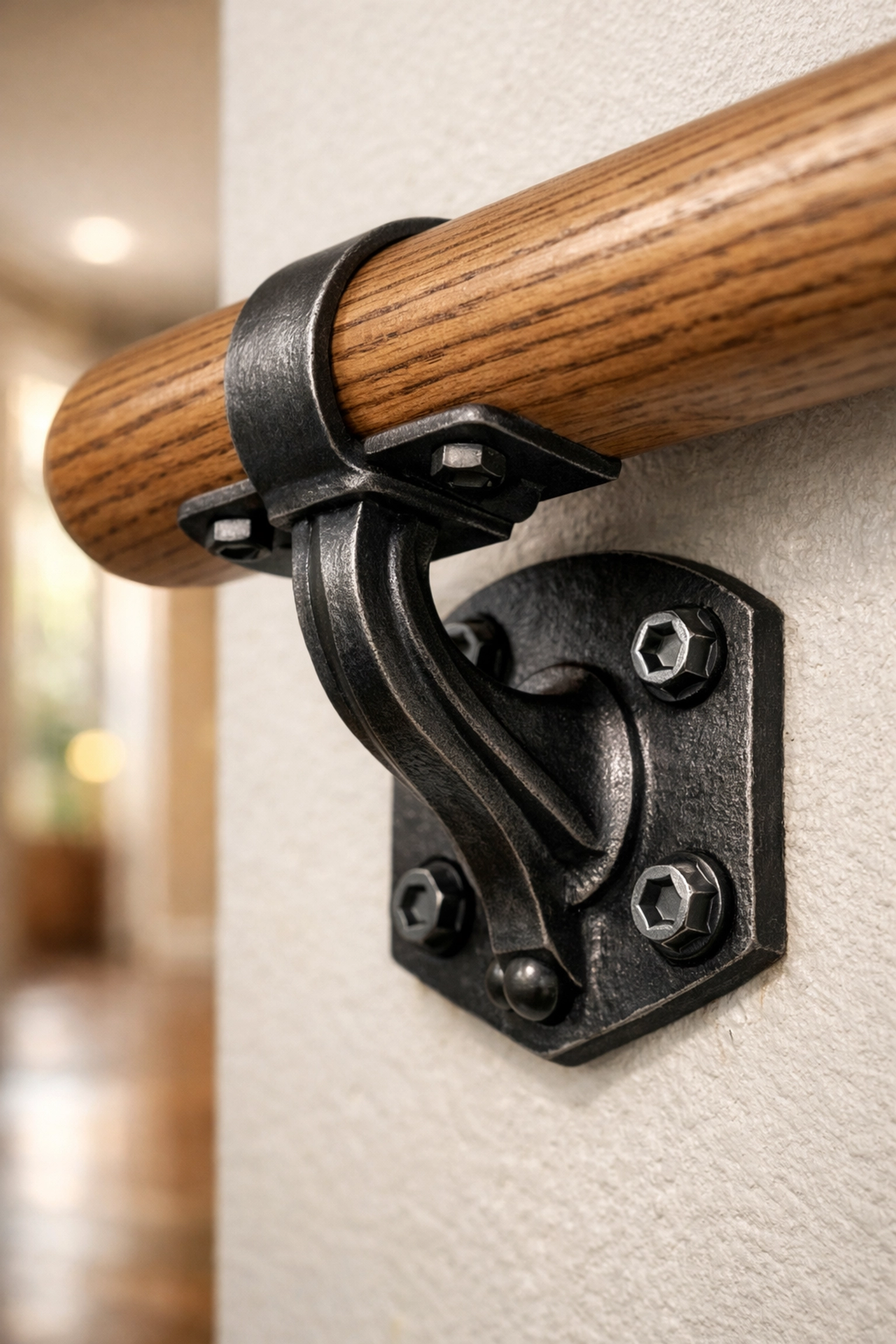 Secure metal handrail bracket anchored to a wall ensuring structural stability for stair safety.