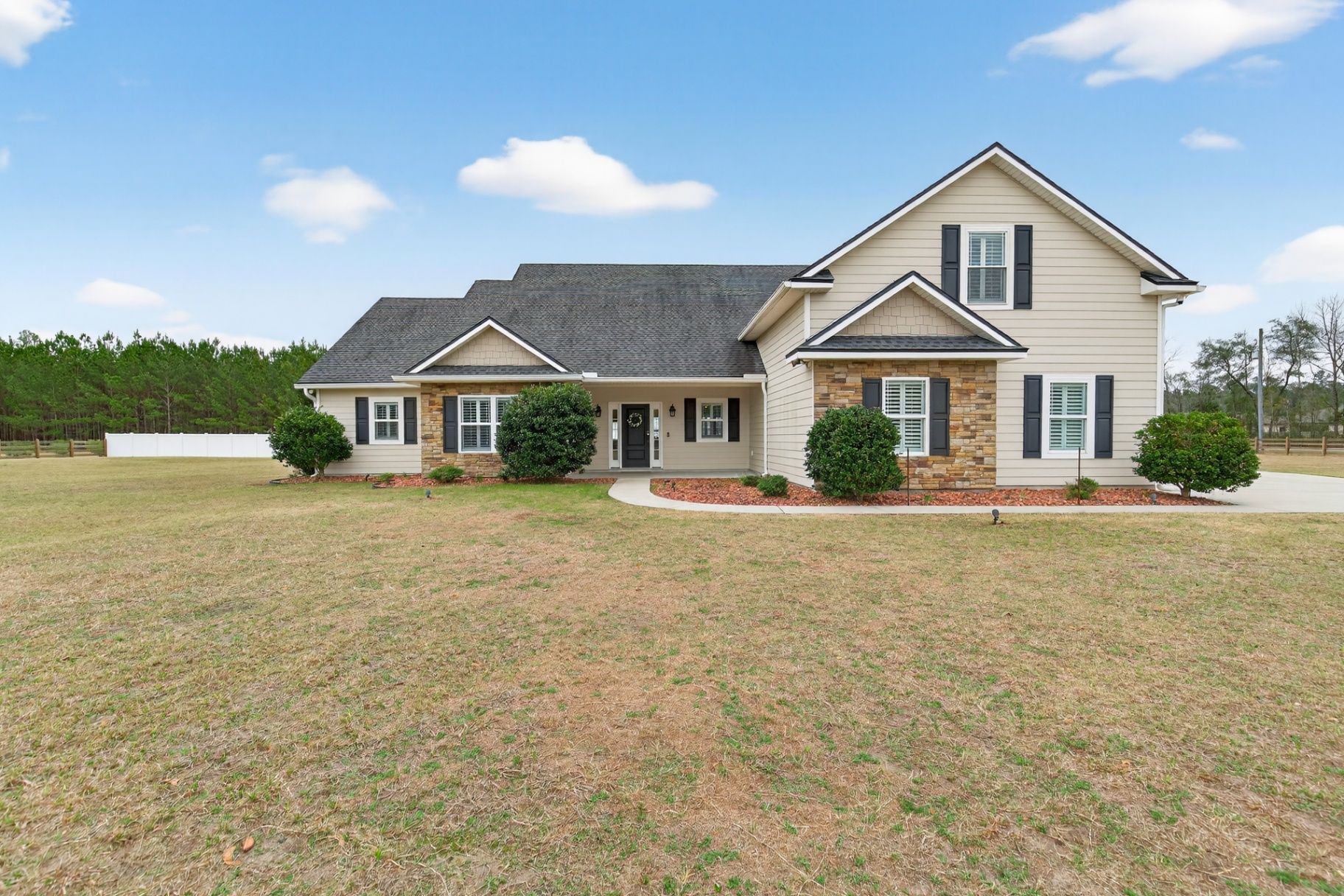 Before grass enhancement at 37575 Kings Ferry showing dry patchy lawn