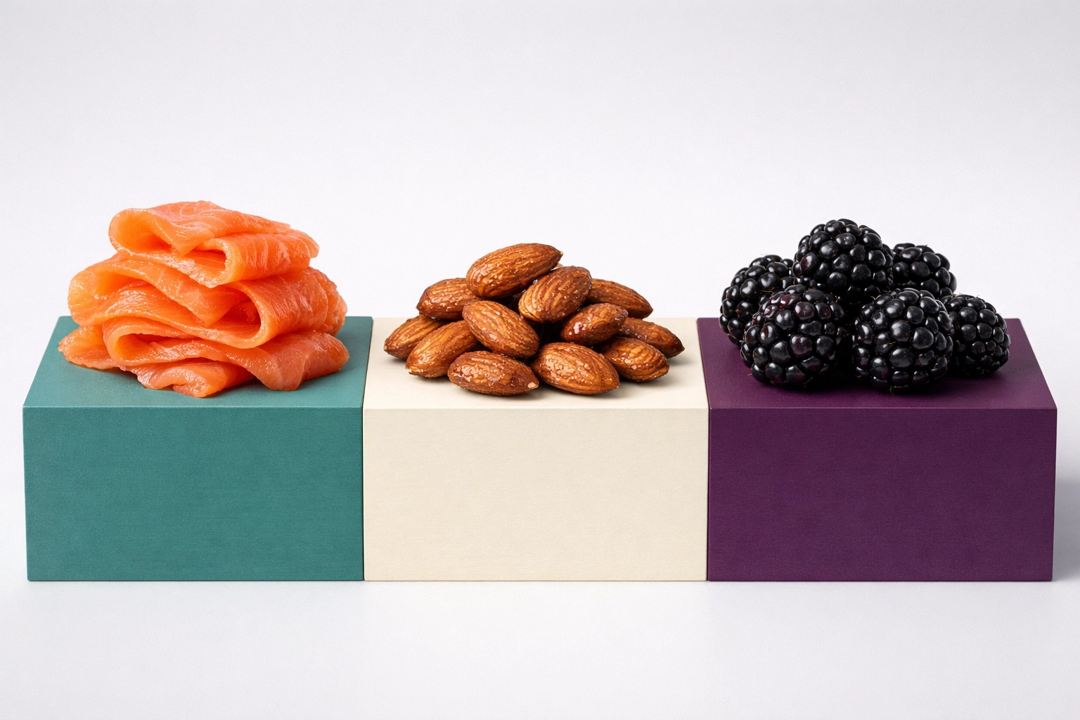 Smoked salmon, almonds, and blackberries arranged to show healthy fats and proteins in a macro-balanced diet.