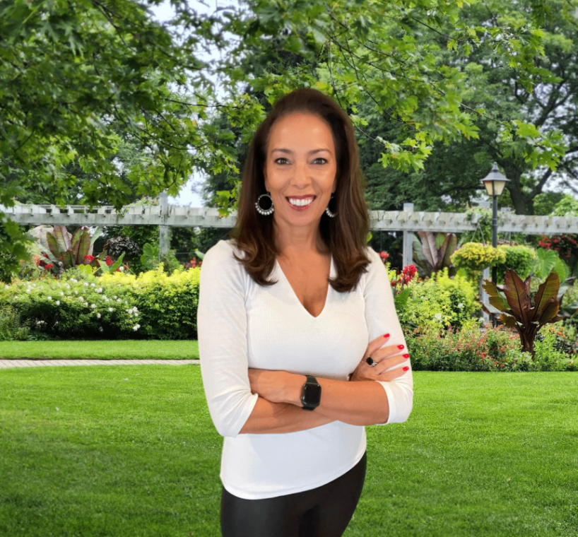 GG Sfreddo, a professional Realtor woman in a Northern Virginia garden