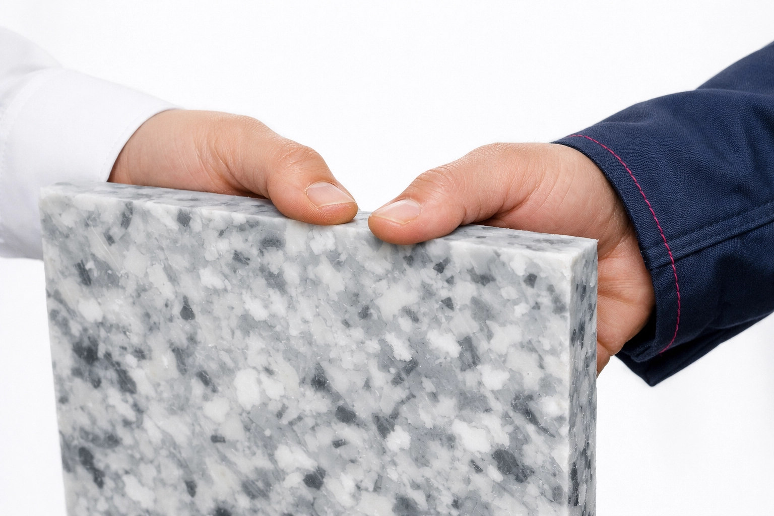 Hands holding a recycled plastic panel, symbolizing a strategic ESG partner program and circular manufacturing.