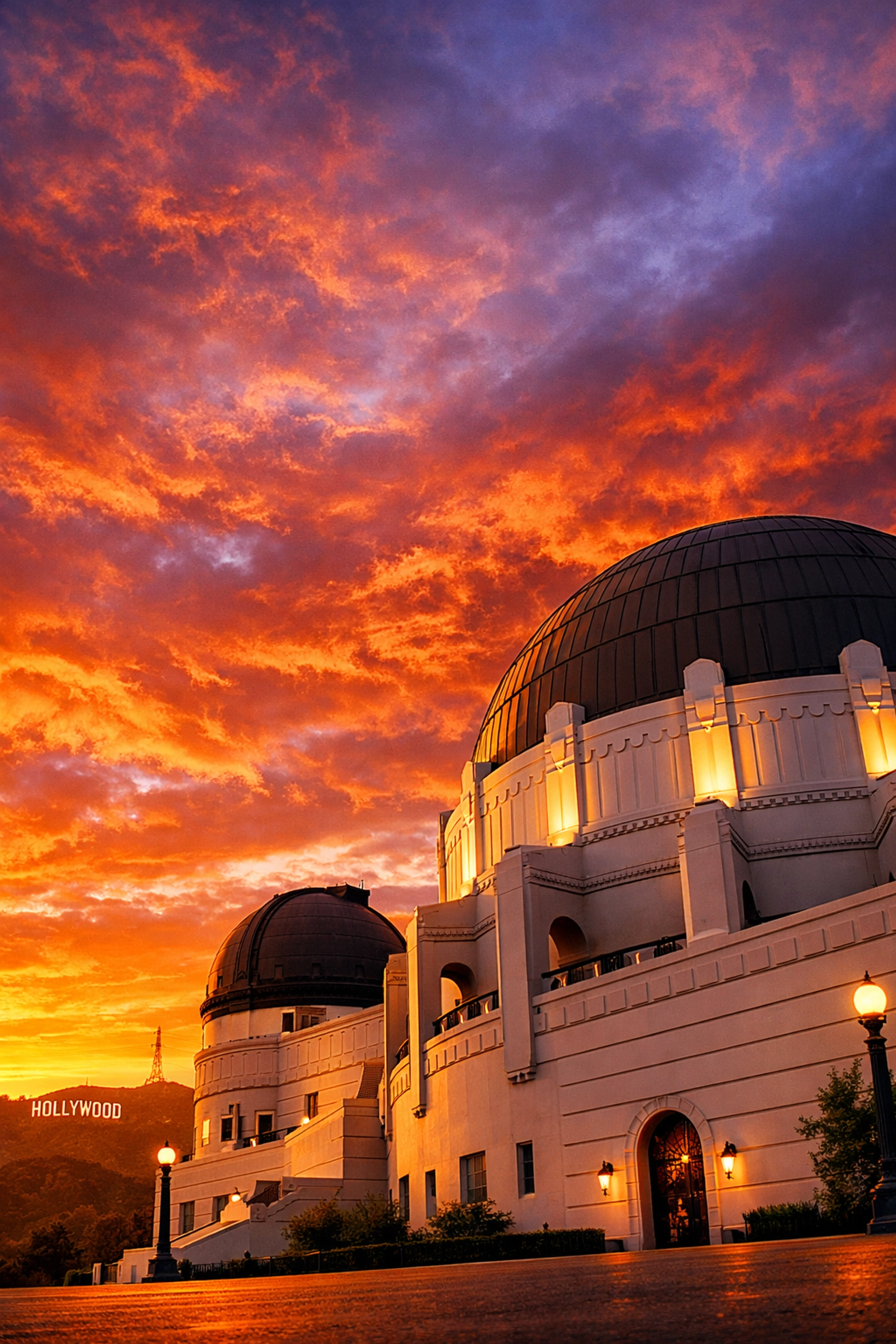 The Griffith Observatory at sunset with the Hollywood sign, a popular shoot location for Los Angeles photographers.