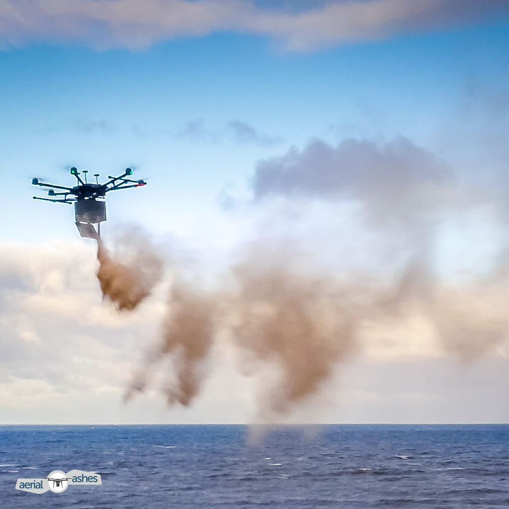 A drone disperses cremated ashes over the sea