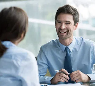 Real estate professional consulting with a client about CRM setup