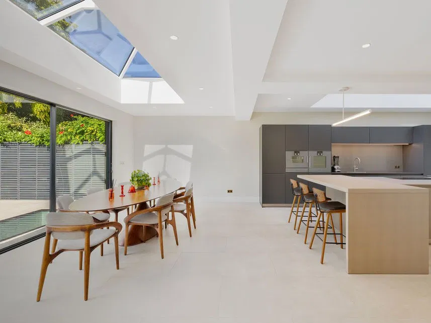 A modern open-plan layout demonstrating how architectural design can maximize natural light and space in a residential setting.