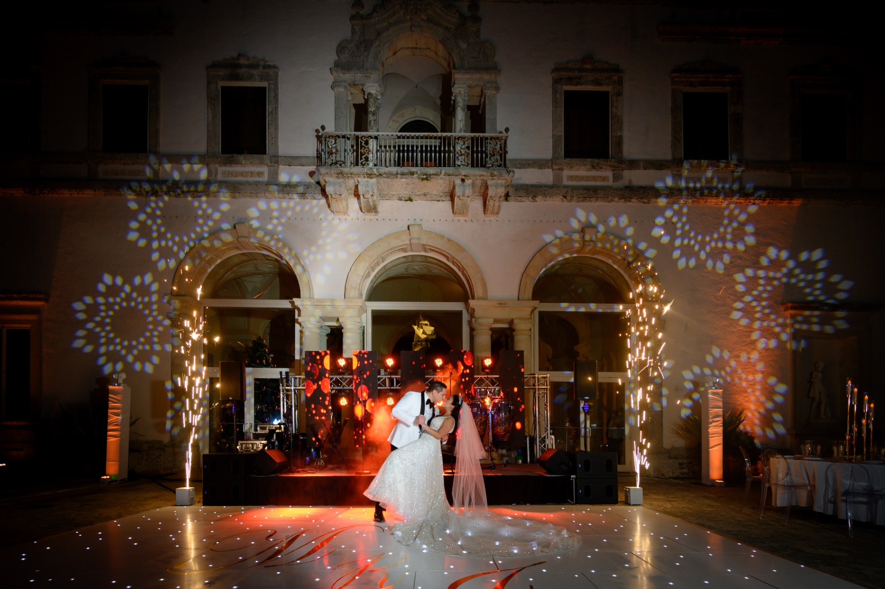 Elegant Miami wedding reception at night with cinematic lighting and a lively dance floor