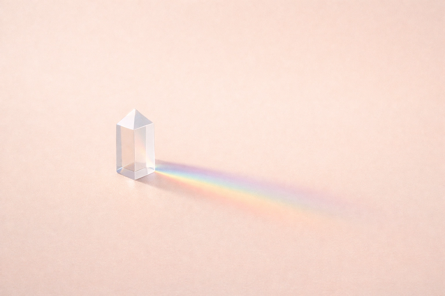 Minimalist glass prism casting a rainbow shadow, symbolizing emotional labor and identity in burnout prevention.