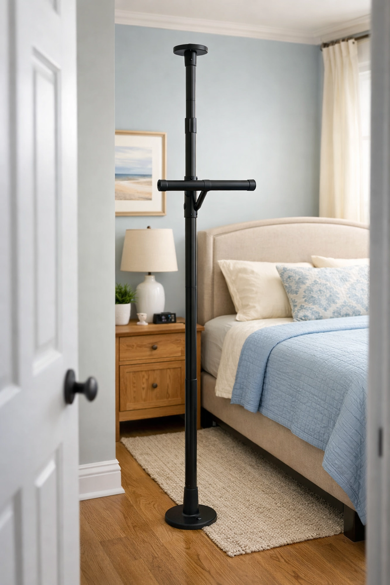 A bedside floor-to-ceiling transfer pole with a grab bar to help seniors stand up safely.