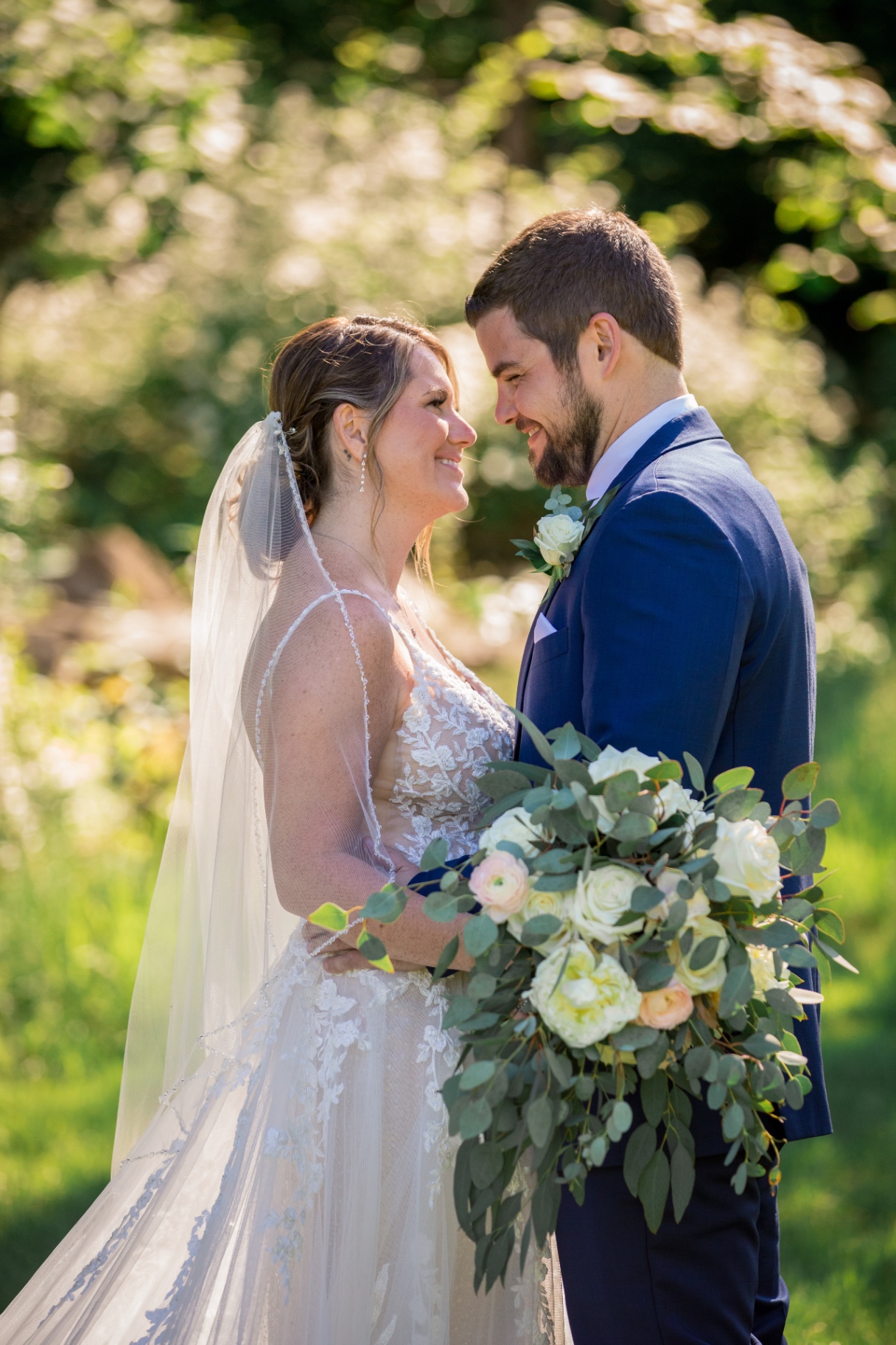 Close-up telephoto shot of Samantha and Tyler embracing with joyful smiles