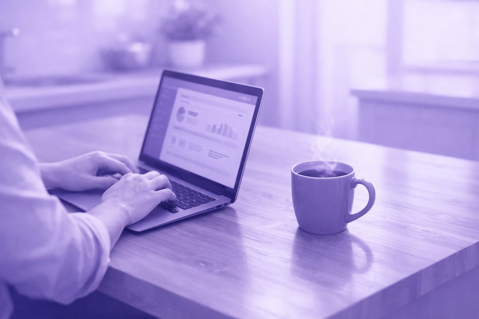 Canadian applying for a no-paperwork emergency loan online using a laptop in a modern kitchen.