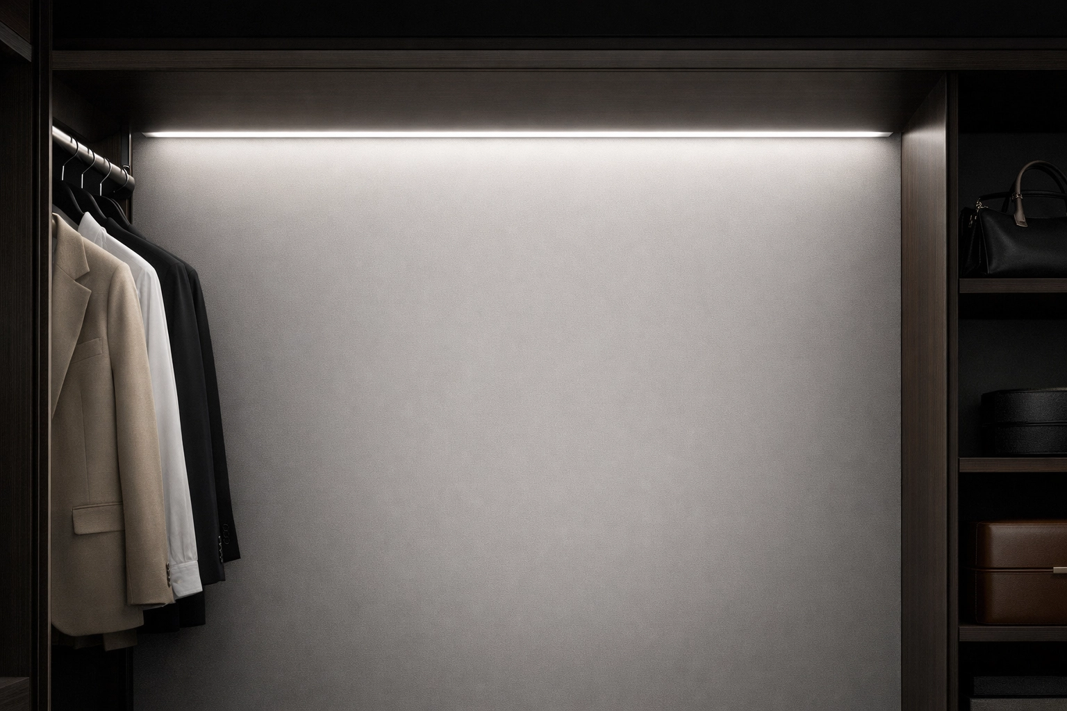 Soft linear LED lighting with perfect diffusion inside a luxury custom wardrobe.
