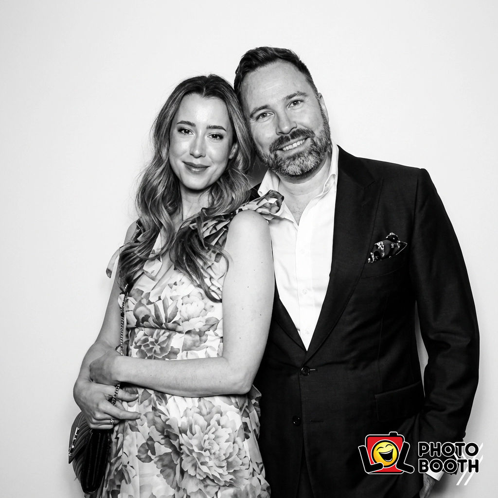 An elegant couple in the B&W “Minimalist White” look — editor’s-choice simplicity that photographs like pure luxury.