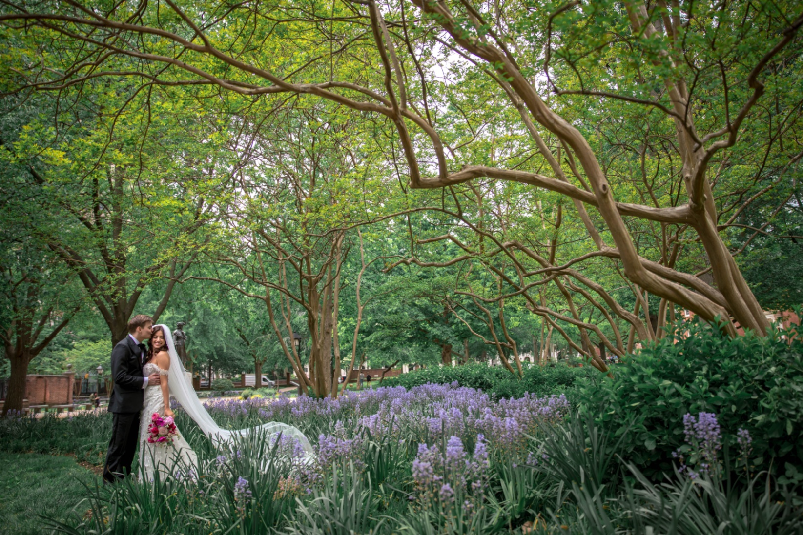 A bride and groom in a romantic garden