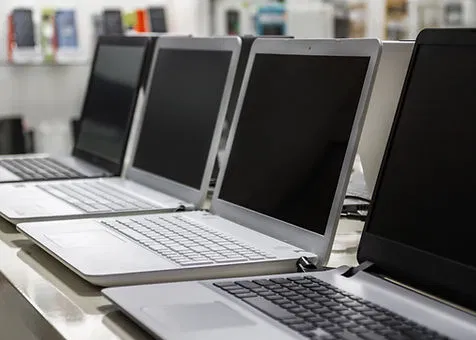 Modern laptops on a desk representing various hardware for real estate operations