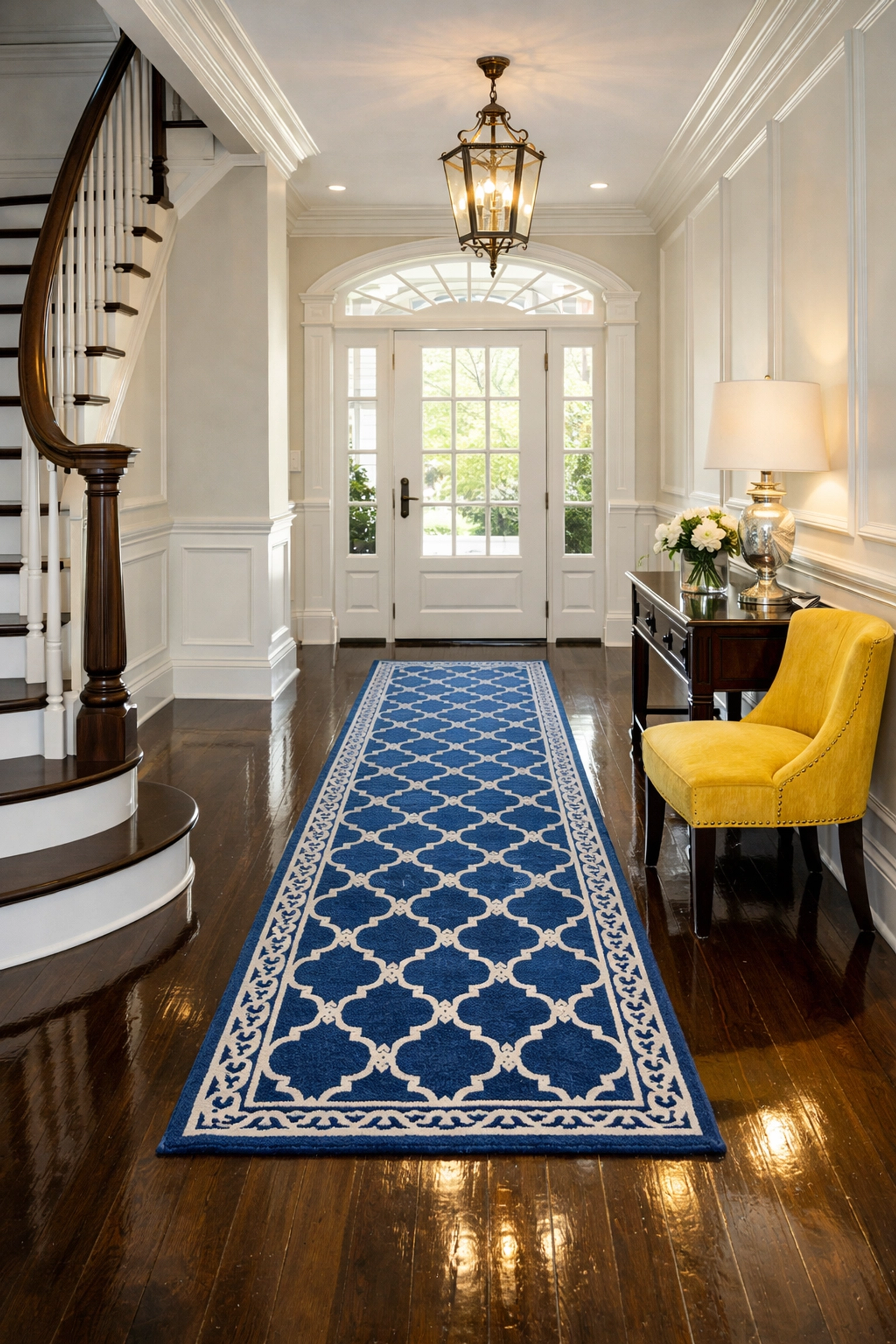 A sparkling grand foyer in Wellesley with gleaming hardwood floors after a thorough deep house cleaning service.