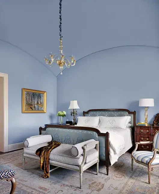Serene-blue-master-bedroom expertly painted with smooth, even finishes and elegant trim.