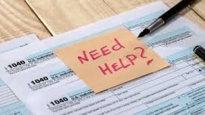 IRS 1040 Tax Forms Assistance A stack of IRS 1040 tax forms with a pen and a sticky note reading 'NEED HELP?' suggests individuals seeking professional assistance with tax preparation and filing, highlighting the support services offered by Brick Taxes LLC.