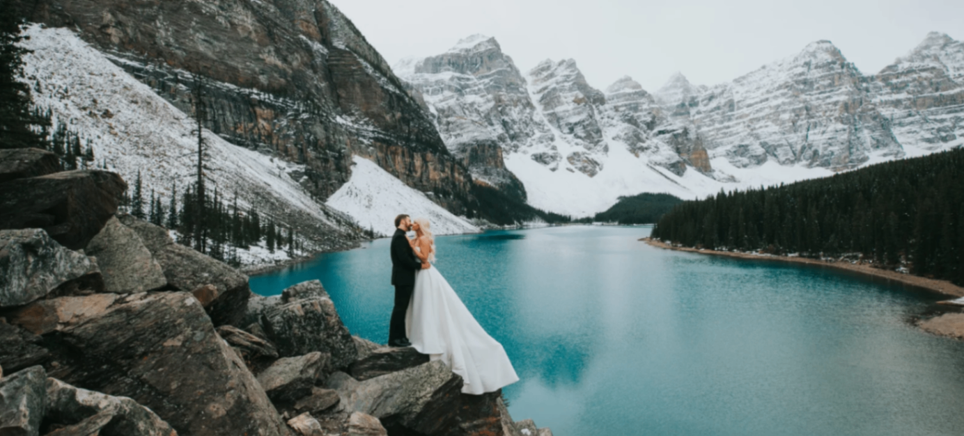 A couple in wedding attire at Moraine Lake