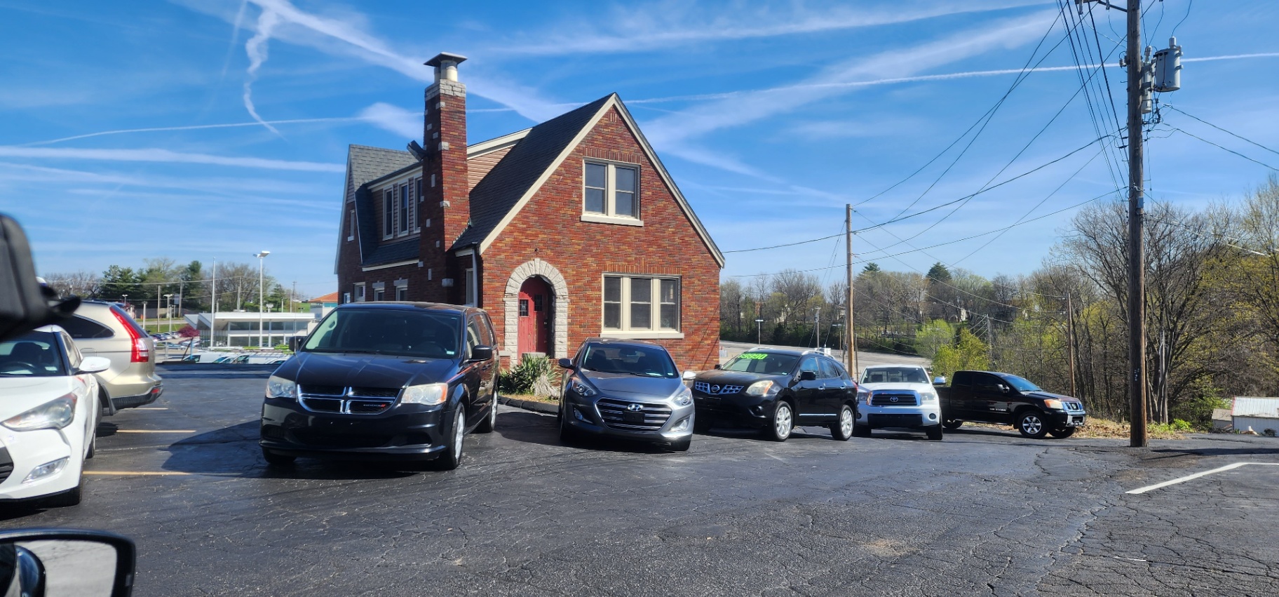 A lineup of pre-owned vehicles at Grateful Motors A lineup of pre-owned vehicles, including vans, SUVs, sedans, and trucks, is parked in front of the Grateful Motors office building. The lot features various popular brands and models, offering customers flexible financing and same-day purchase options.