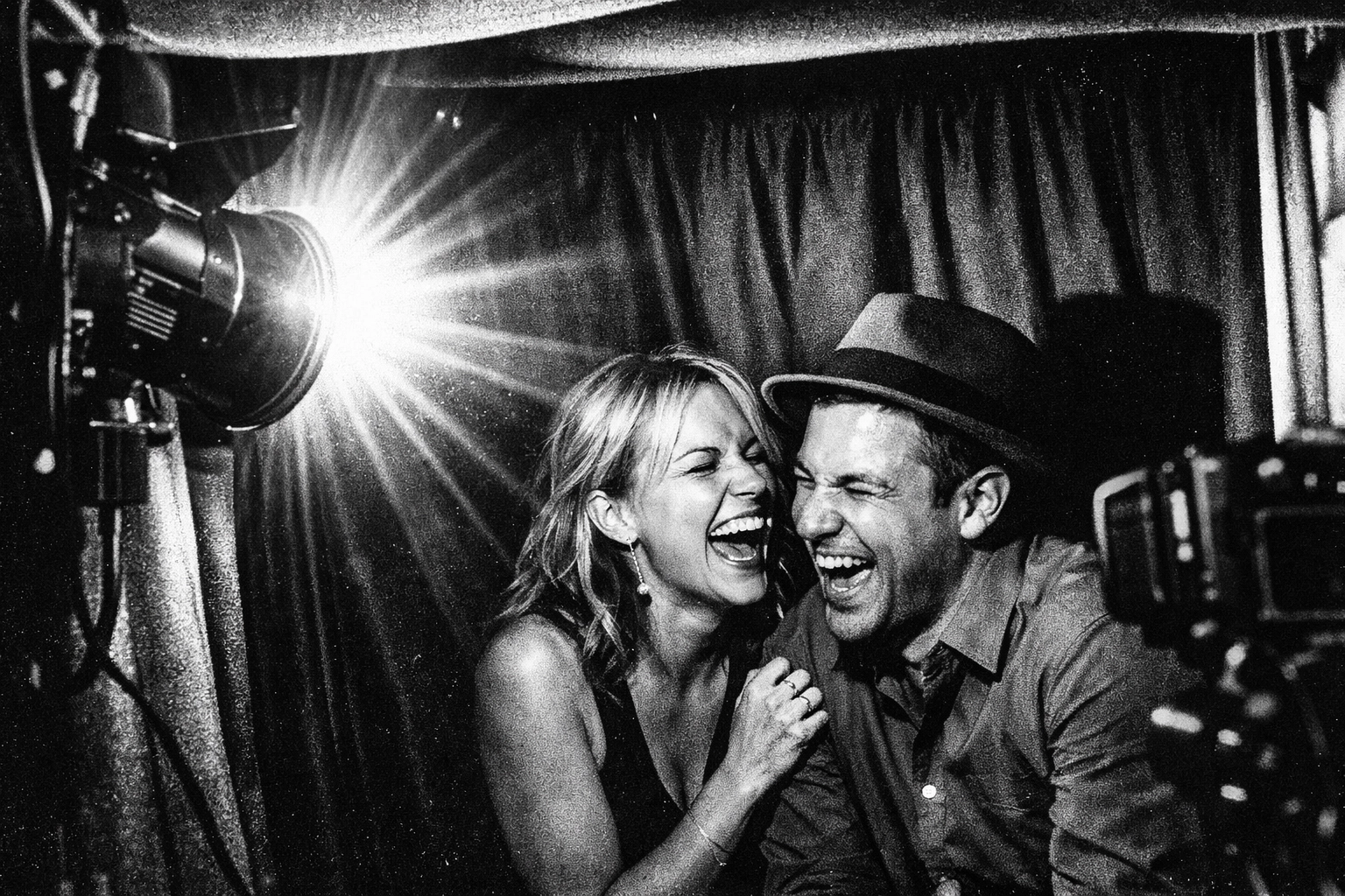 High-flash photography inside enclosed photo booth creating vintage film aesthetic