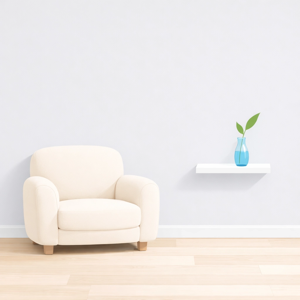 Minimalist neutral living room with a cream armchair, showing how to declutter a home for a successful sale to 2026 buyers.