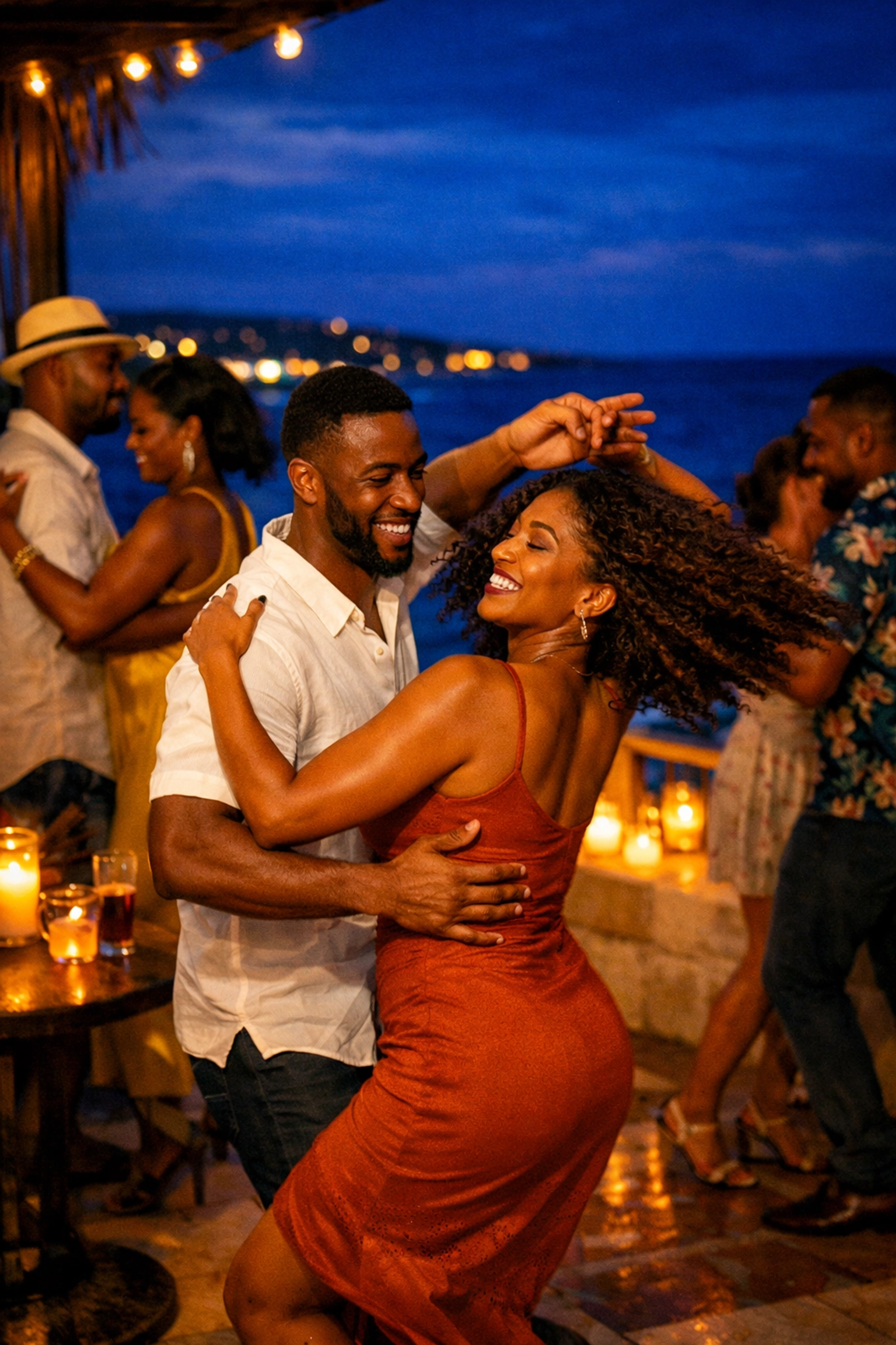 Black travelers dancing Chicago Stepping on a Caribbean terrace at twilight during a luxury experiential travel getaway.