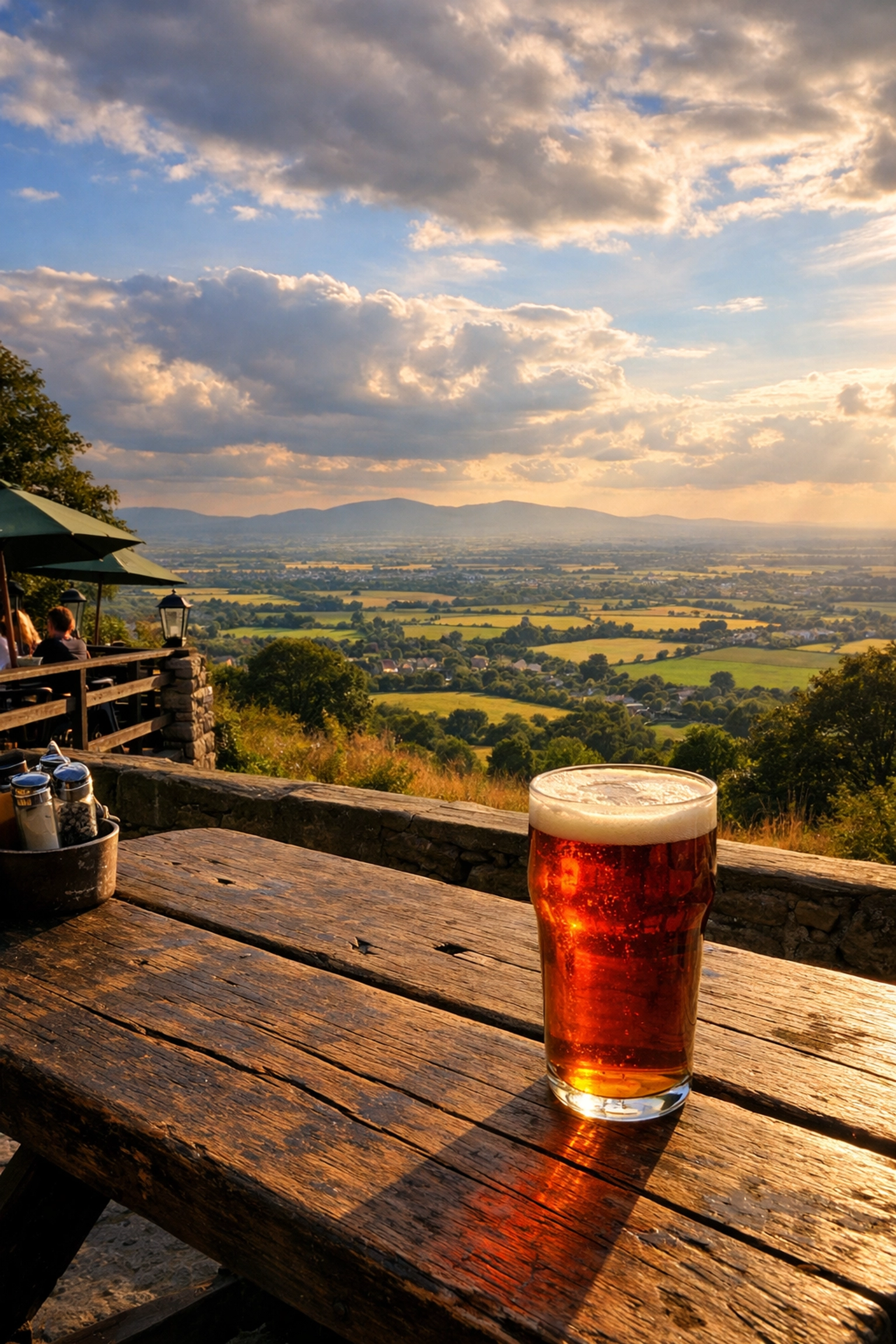 Scenic view from The Mount Inn pub garden in Stanton overlooking the rolling Cotswold countryside.