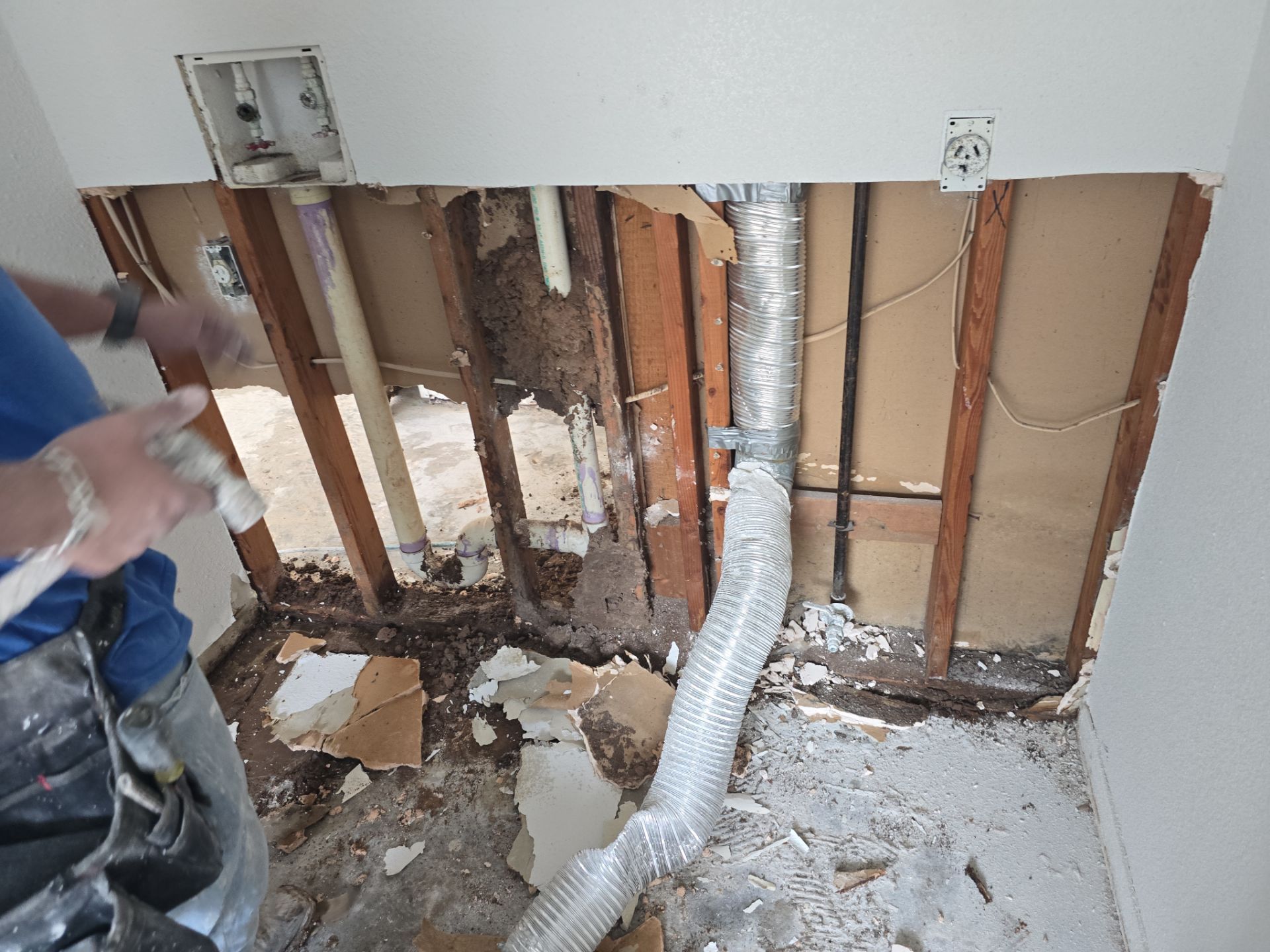 Wall Partially Demoed with Water Damage and Mold Growth