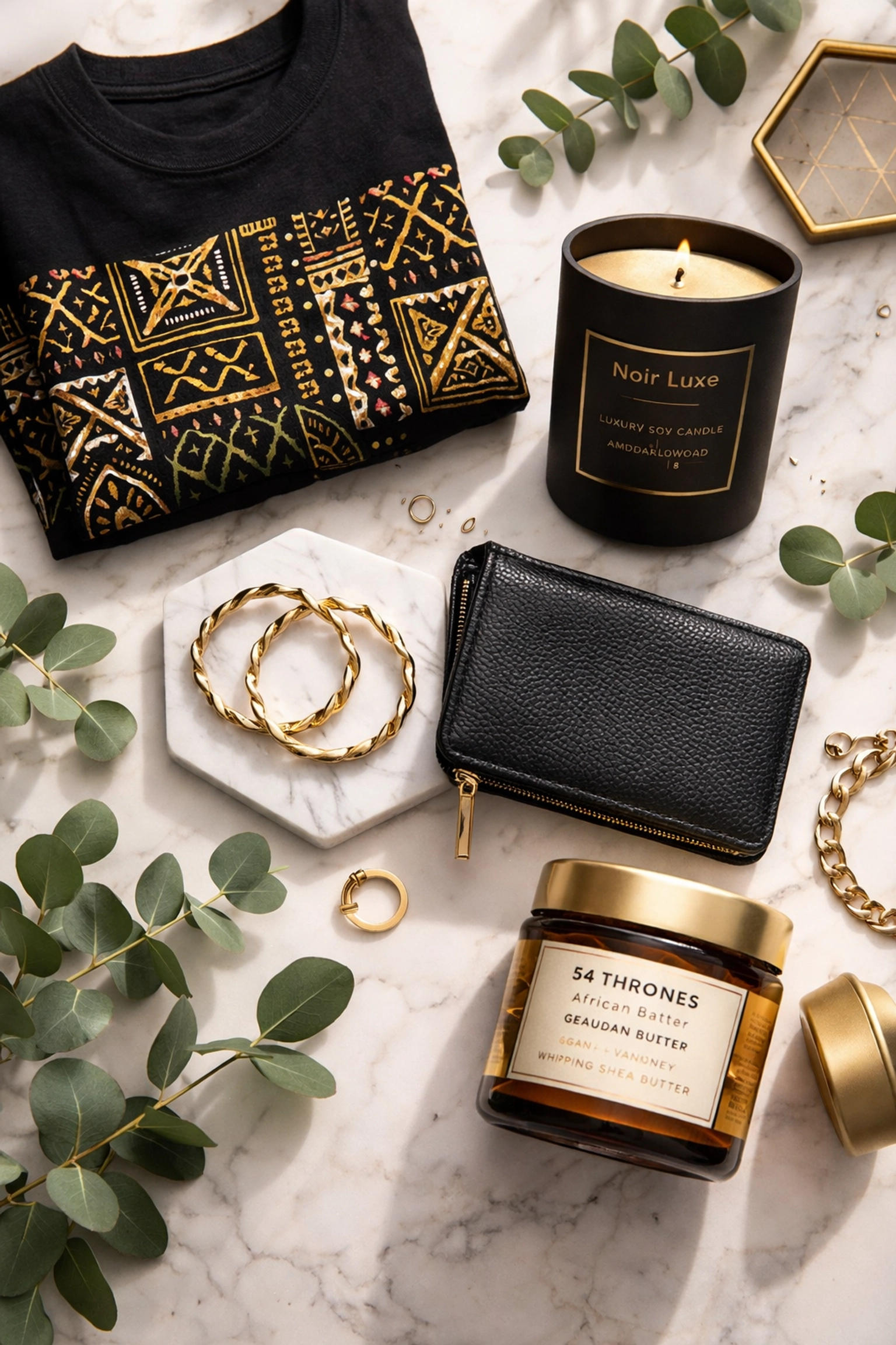 Buyblack: Why It's the Most Powerful Financial Move You'll Make in 2026 Marble tabletop showcasing products from Black-owned brands, including jewelry, candles, and apparel