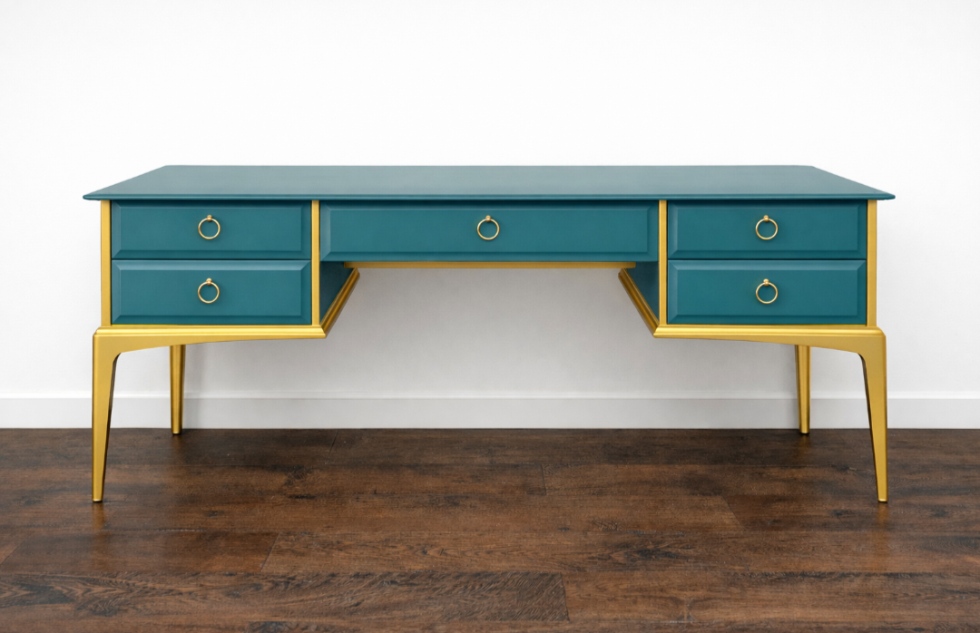 Teal blue and gold luxe Stag-style desk/dressing table with polished gold hardware.