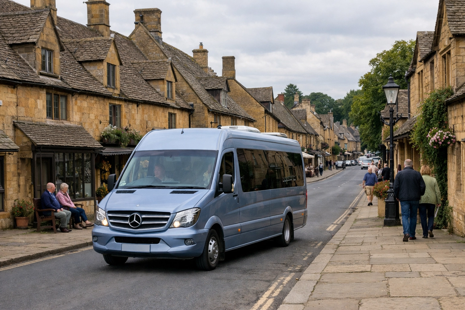 Touring the historic honey-colored stone buildings of Broadway village in a Mercedes minibus.