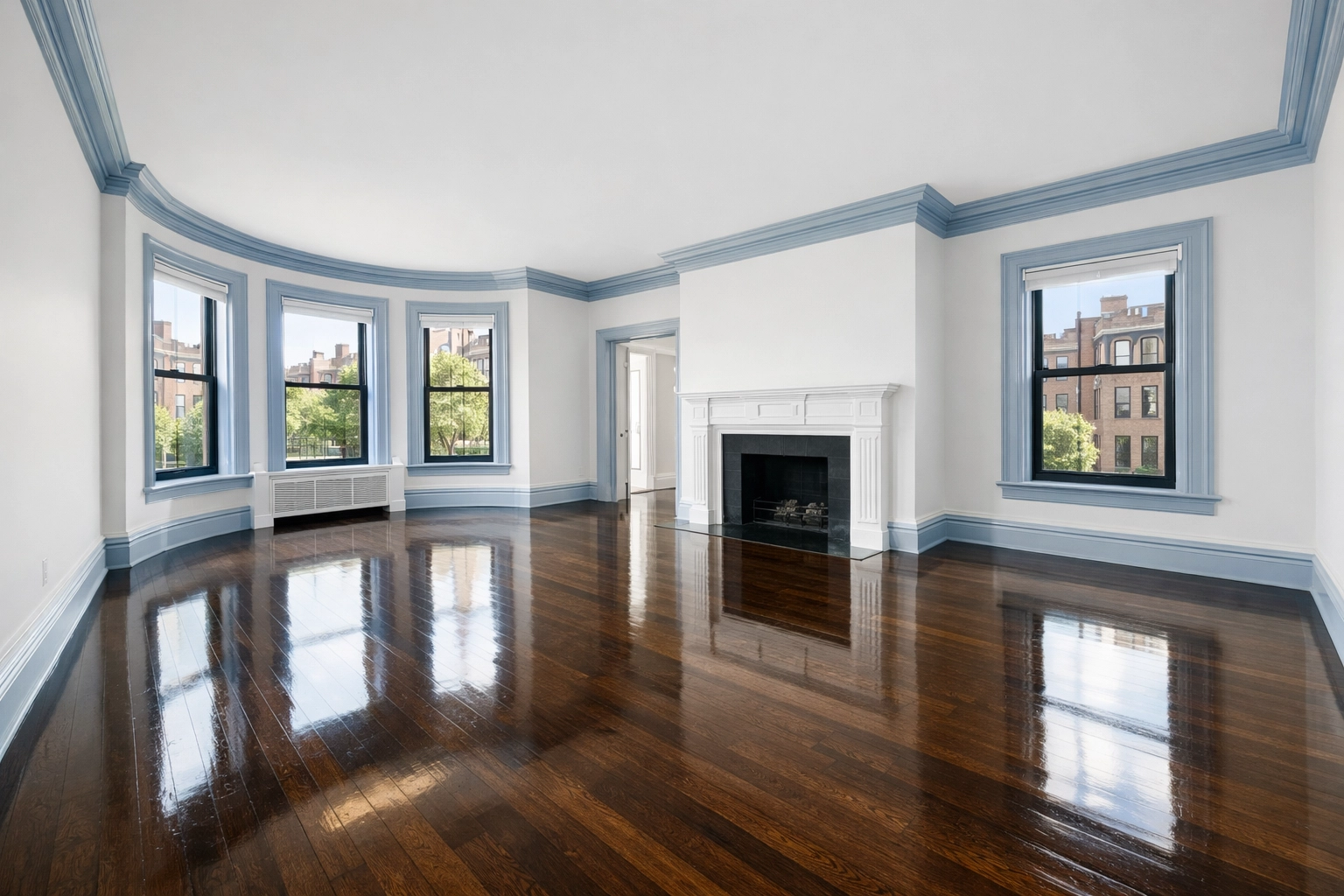 Empty luxury Boston apartment with gleaming floors following a thorough move-out cleaning.
