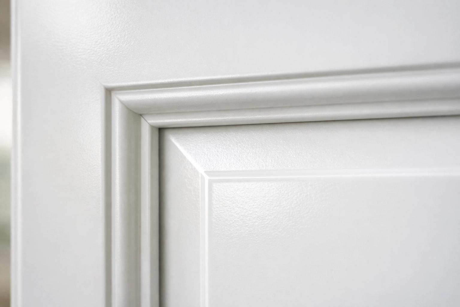 Close-up of smooth spray painted cabinet door showing professional finish quality