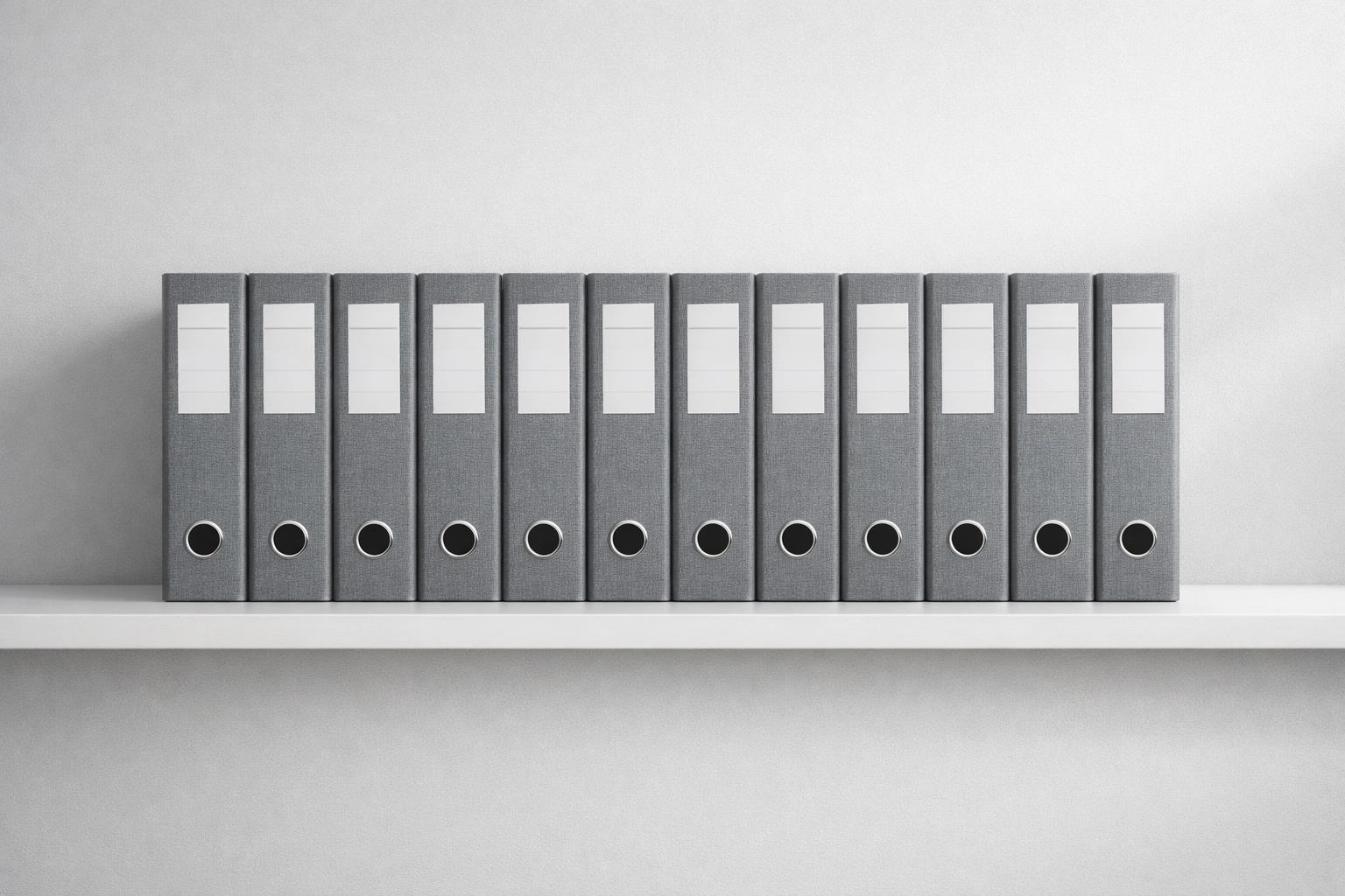Organized professional binders on a shelf highlighting ERO recordkeeping and tax office documentation standards.