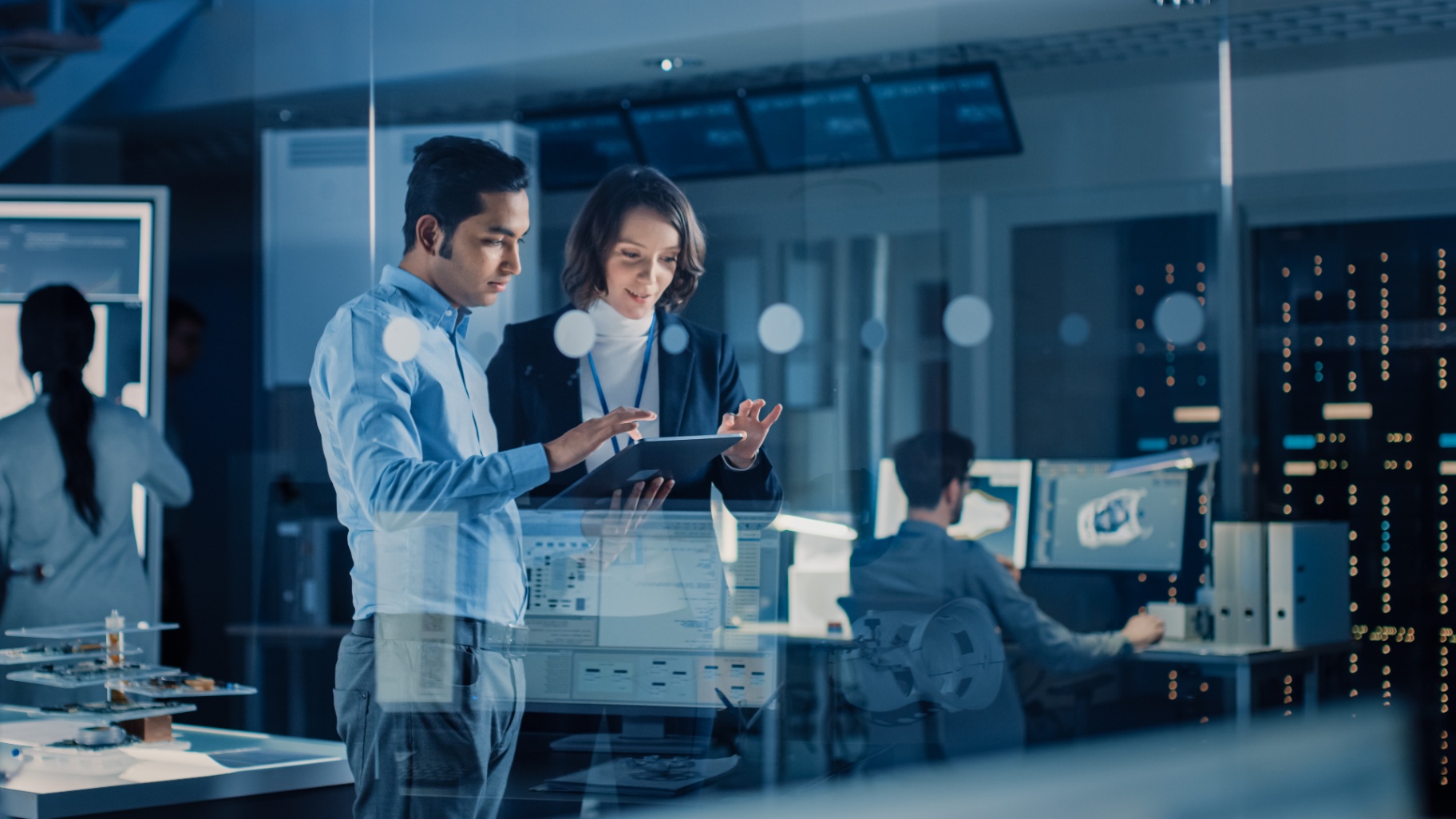 IT Professionals Collaborating in Modern Office