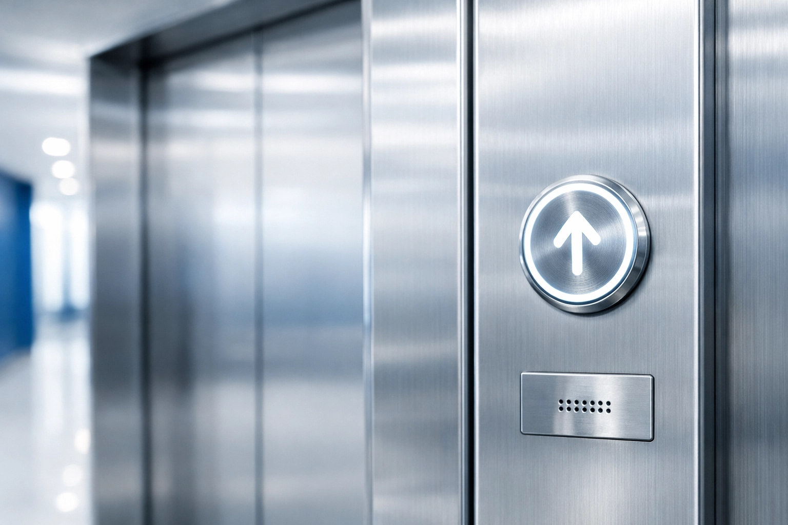 Sanitized stainless steel elevator bank in a high-end Framingham office building.
