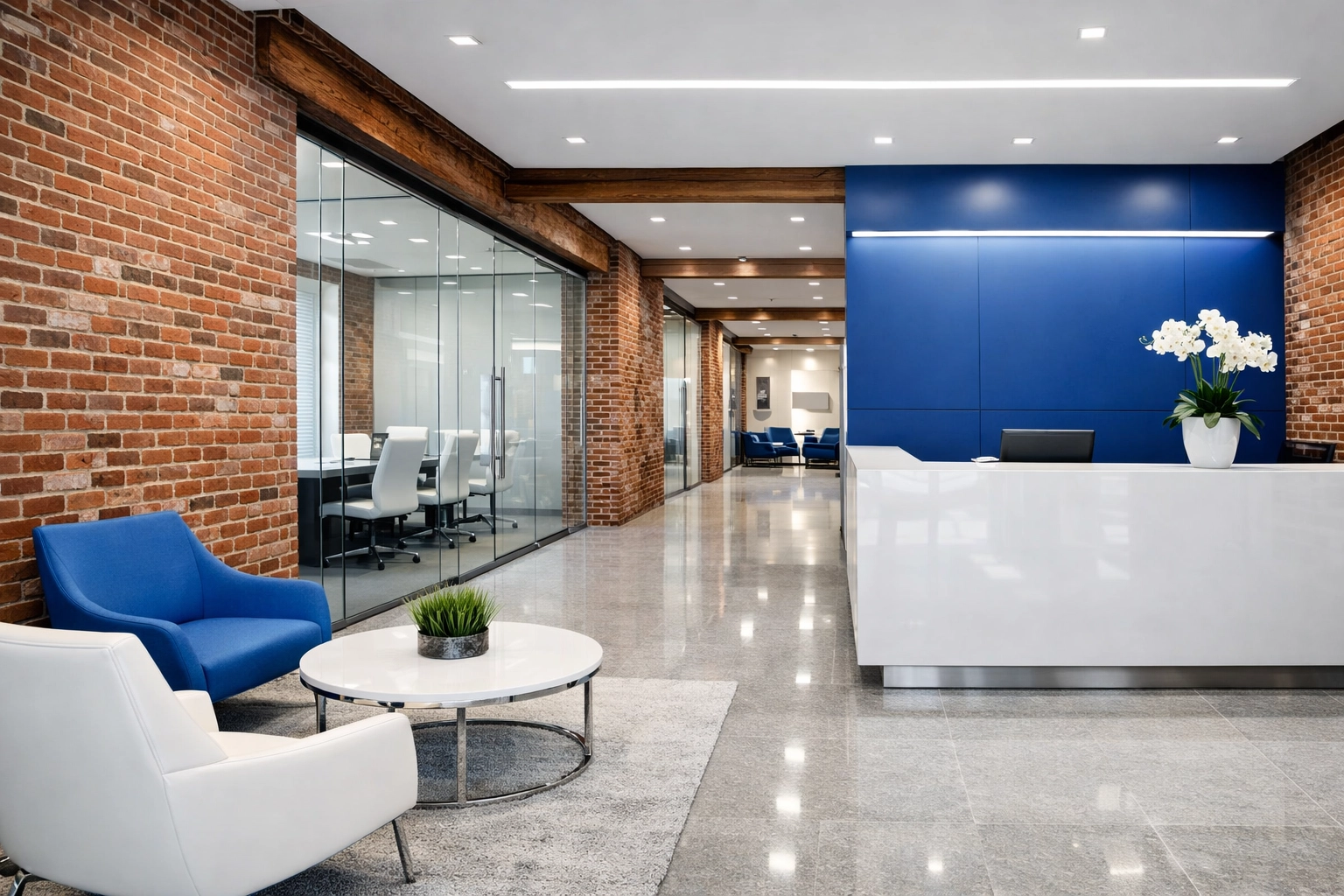 Professional commercial office lobby in a Lawrence mill building featuring dust-free glass and brick surfaces.