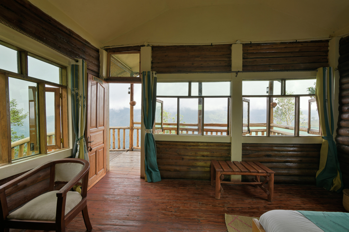 Evening at Orugano Bwindi Lodge – sustainable eco-luxury lounge with forest views