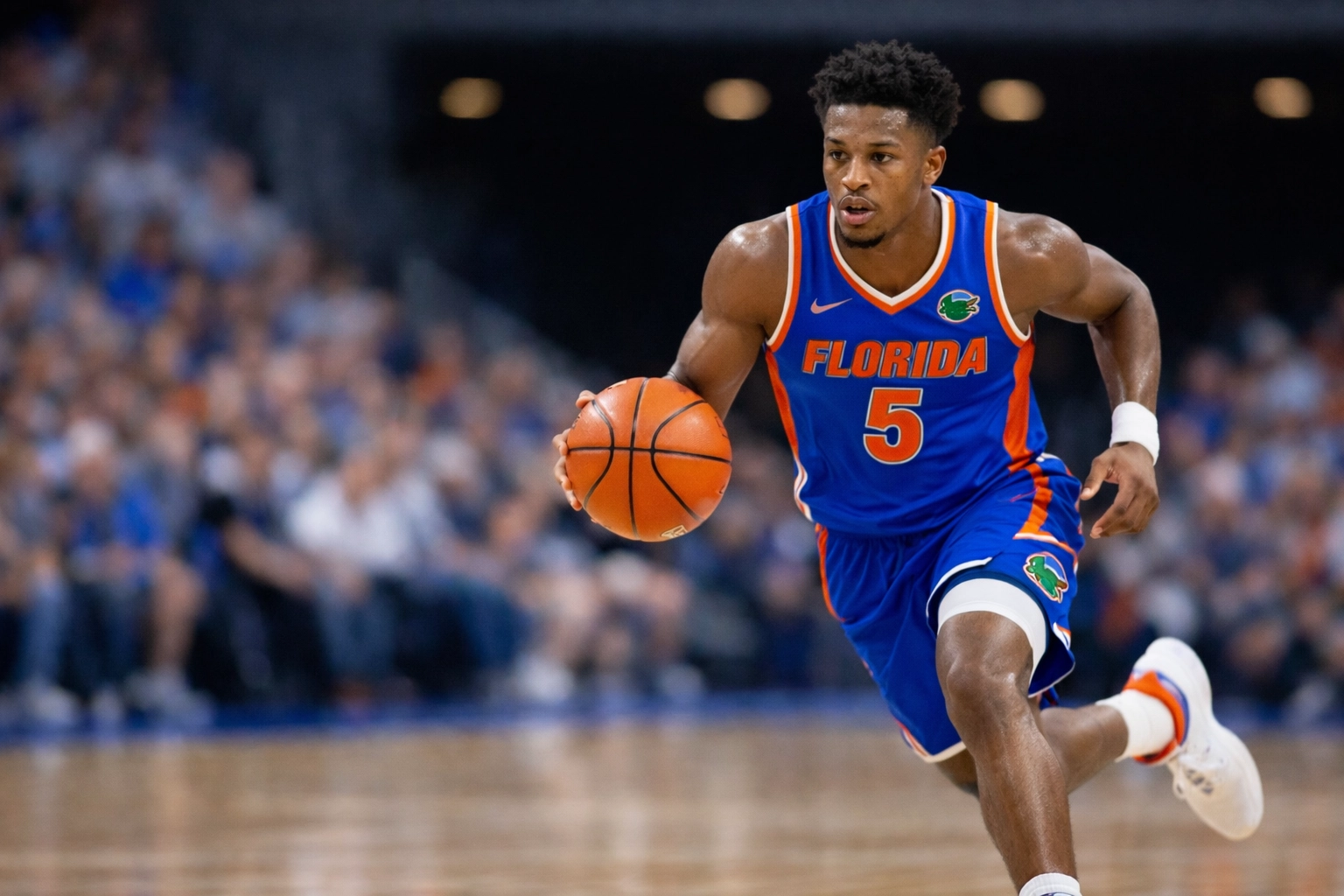 Florida Gators basketball player leading a fast break during the 2026 SEC conference season.