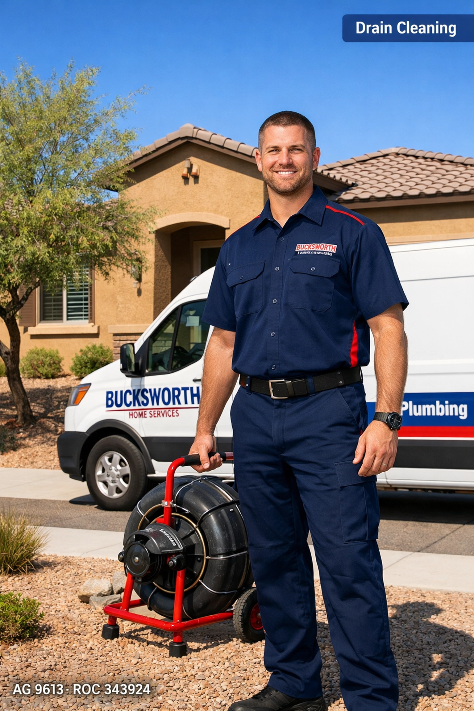Professional plumber in Queen Creek AZ standing by service truck for drain cleaning.