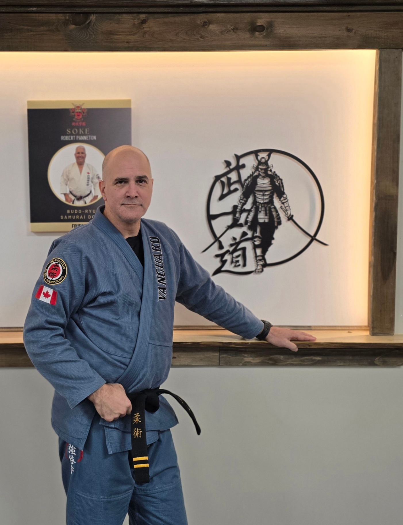Instructor in Blue Gi at Vanguard Self-Defense Academy