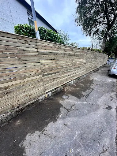 Modern horizontal slatted timber fence with clean lines