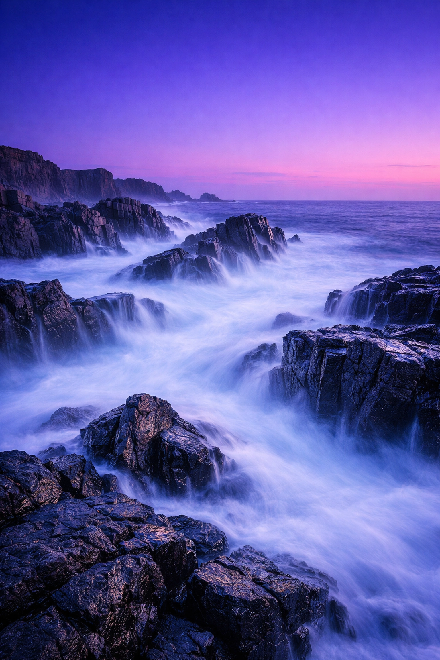 Long-exposure photo of a coastline at blue hour, illustrating manual mode 101 techniques.