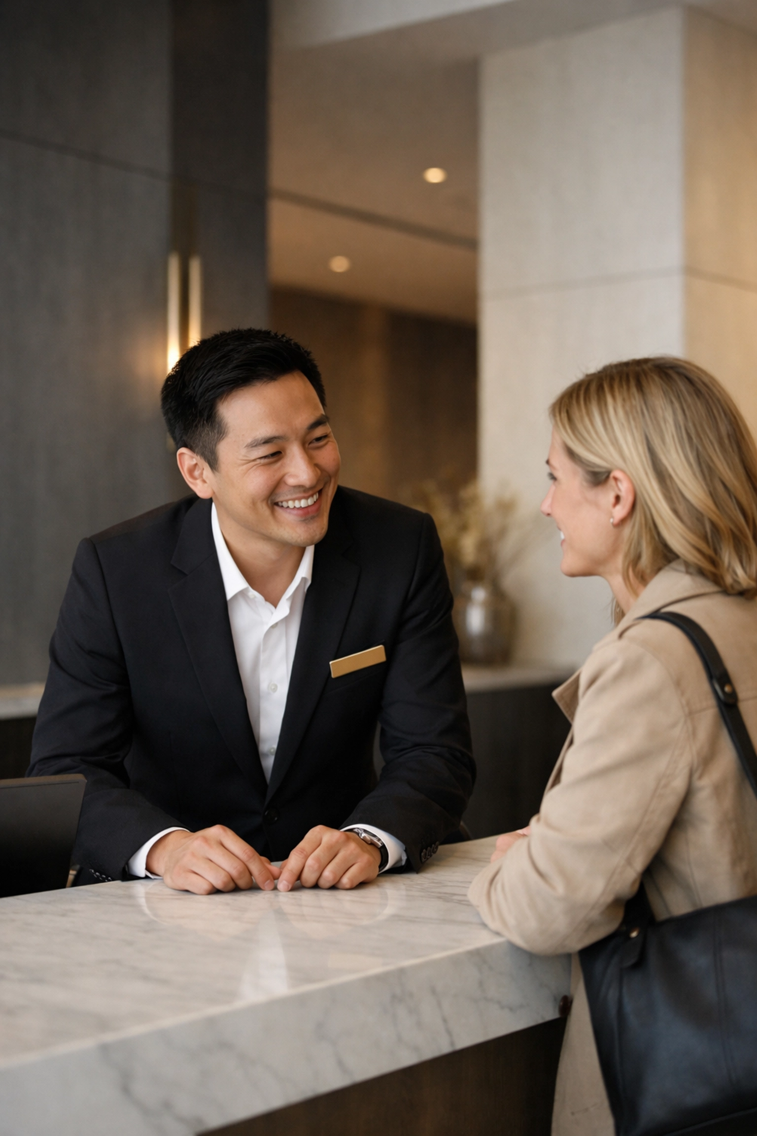 Hotel staff providing high-touch hospitality using data from hotel revenue management software.