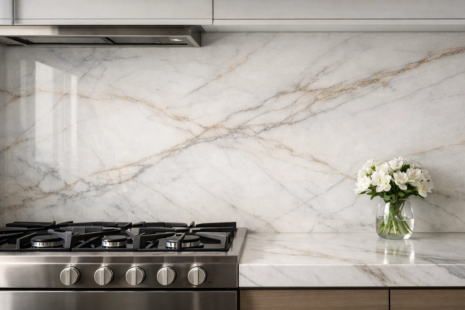 Luxury kitchen remodeling in Orlando with a seamless white quartzite stone slab backsplash.