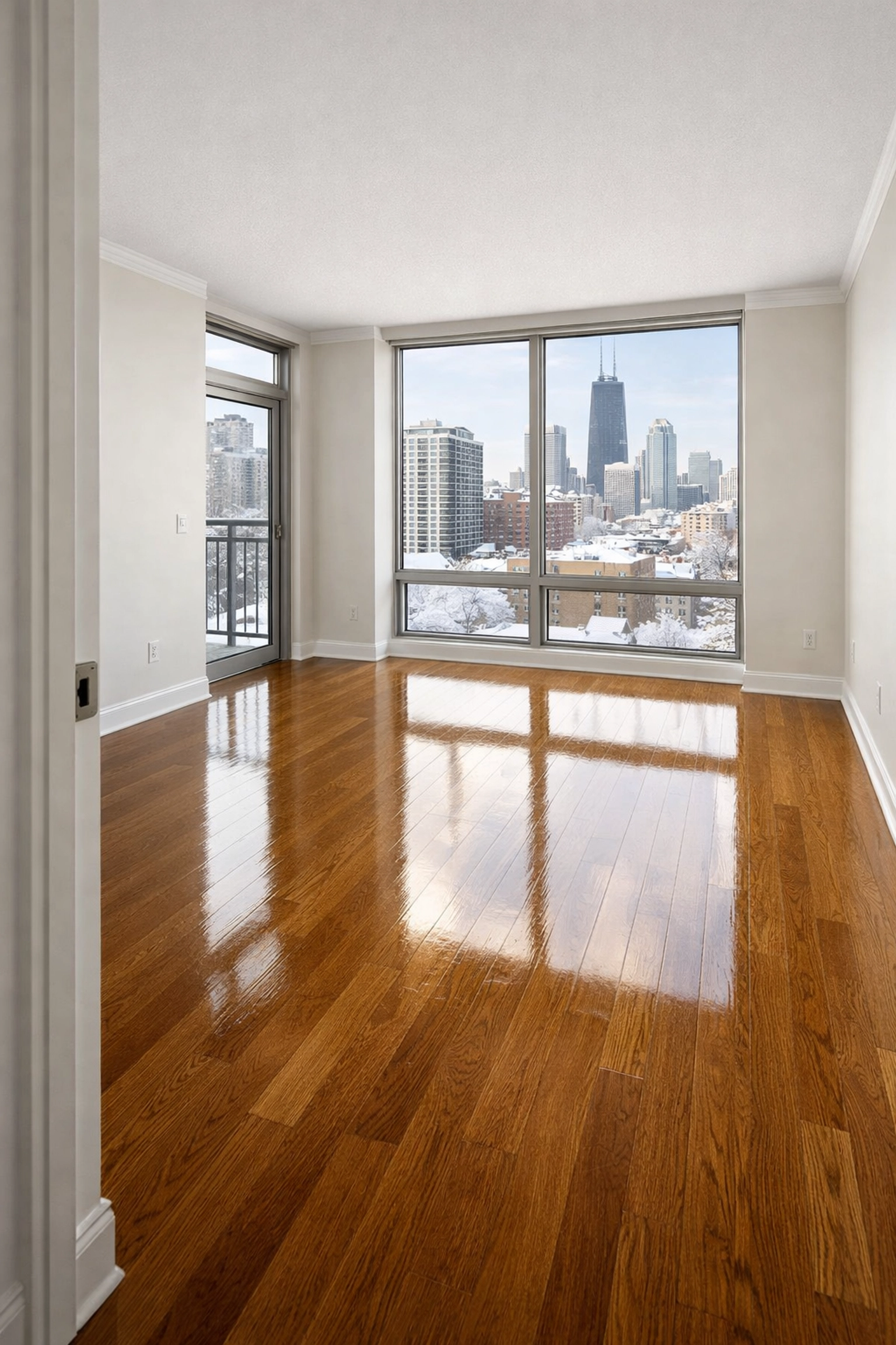 Freshly cleaned Chicago apartment ready for move-in with spotless floors and winter city view