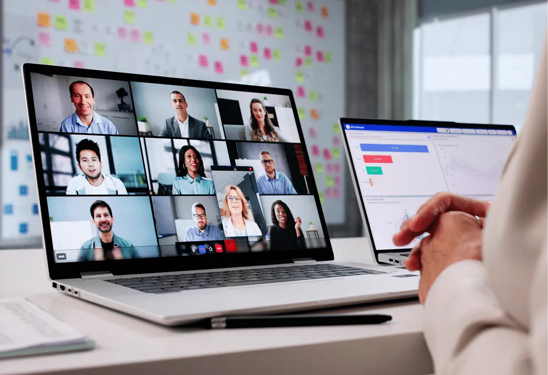 A service manager participating in a virtual coaching session, showcasing remote advisor development